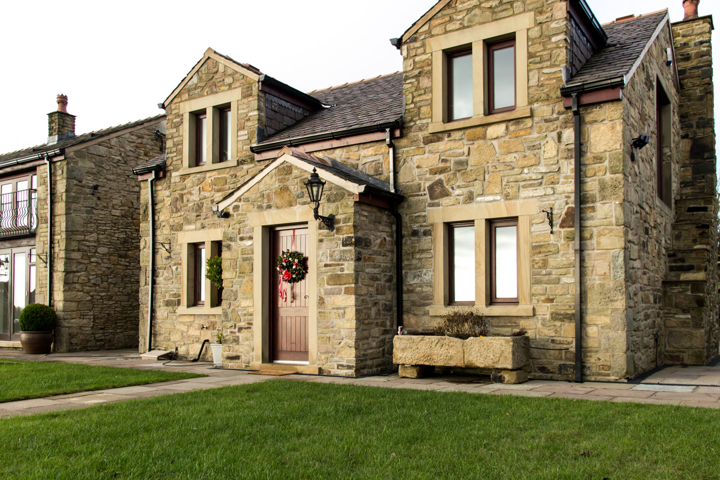 Traditional UK stone detached house with double garage